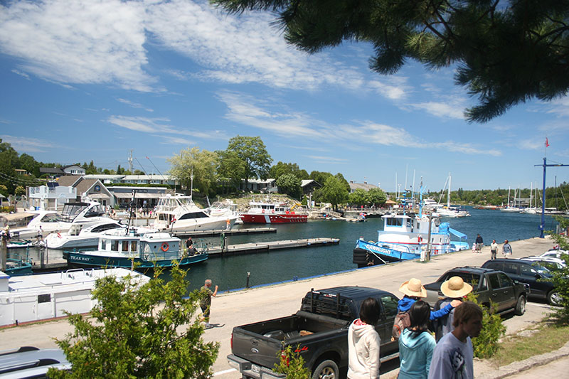 CCGS Kelso, a tug, and other vessels, moored in Tobermory